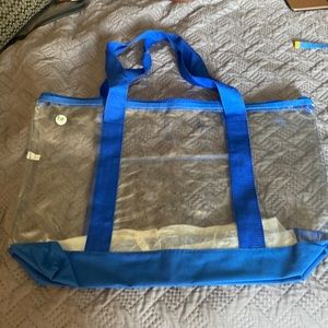 NWT clear plastic tote bag with shoulder straps.